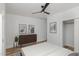 Staged bedroom boasts modern accents, wood-look floors, closet with sliding doors, and ceiling fan at 15 St Augustine, Raleigh, NC 27610