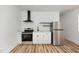 Bright kitchen features stainless steel appliances, white cabinets, and modern countertops at 15 St Augustine, Raleigh, NC 27610