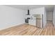 Newly renovated kitchen features stainless steel appliances, white cabinets, and modern fixtures at 15 St Augustine, Raleigh, NC 27610