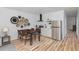 Modern kitchen featuring stainless steel appliances, a dining table, and a trendy decor at 15 St Augustine, Raleigh, NC 27610