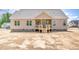 New construction home features a rear porch and several windows at 163 Royal Ave, Selma, NC 27576