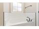 Bathroom features large soaking tub, tile surround, and modern fixtures at 163 Royal Ave, Selma, NC 27576