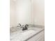 Bathroom features granite countertops, white cabinet, and sleek fixtures at 163 Royal Ave, Selma, NC 27576