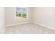 Bedroom with carpeted floor, white trim, and plenty of natural light at 163 Royal Ave, Selma, NC 27576