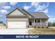 Charming single-Gathering home with a two-car garage, covered porch and neutral siding at 163 Royal Ave, Selma, NC 27576