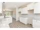 Eat-in kitchen showcases white cabinets, granite countertops, and modern finishes at 163 Royal Ave, Selma, NC 27576