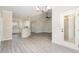 Open concept living area featuring luxury vinyl plank flooring, a kitchen bar, and modern lighting at 163 Royal Ave, Selma, NC 27576