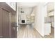Open concept living room featuring luxury vinyl plank flooring and a modern fireplace at 163 Royal Ave, Selma, NC 27576