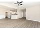 Open concept living space with sleek lighting, luxury vinyl plank flooring, and modern finishes at 163 Royal Ave, Selma, NC 27576