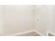 Neutral walk-in closet features a shelf and light wood floors at 163 Royal Ave, Selma, NC 27576