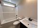 Bathroom with a white shower and a sink vanity featuring white countertop and modern black fixtures at 18 Bonnybrook Ct, Selma, NC 27576