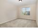 Bedroom featuring neutral walls and carpet and a window view at 18 Bonnybrook Ct, Selma, NC 27576