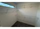 Walk-in closet with wire shelving and plush carpeting at 18 Bonnybrook Ct, Selma, NC 27576