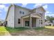 Rear exterior view highlighting siding, back porch, and yard at 18 Bonnybrook Ct, Selma, NC 27576