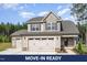 Charming two-story home with a three-car garage and well-maintained landscaping at 18 Bonnybrook Ct, Selma, NC 27576