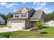 Charming two-story home with a three car garage and attractive landscaping at 18 Bonnybrook Ct, Selma, NC 27576