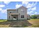 Back exterior view showcasing siding, well-placed windows, and back porch with ceiling fan at 18 Bonnybrook Ct, Selma, NC 27576