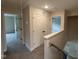 Upstairs hallway with neutral walls, access to bedrooms, and a double door closet at 18 Bonnybrook Ct, Selma, NC 27576