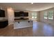 Open kitchen featuring dark cabinets, granite countertops, stainless steel appliances and recessed lighting at 18 Bonnybrook Ct, Selma, NC 27576