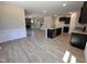 Open concept living space including the living room, dining area, and kitchen with dark cabinets at 18 Bonnybrook Ct, Selma, NC 27576