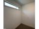 Empty room with neutral walls and carpet, illuminated by a window at 18 Bonnybrook Ct, Selma, NC 27576