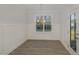 Dining room with hardwood floors, wainscoting, and a modern chandelier at 18 S Rowsham Pl, Smithfield, NC 27577