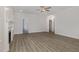 Bright living room with fireplace, wood floors, and neutral wall color at 18 S Rowsham Pl, Smithfield, NC 27577