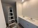 Bathroom featuring double sink vanity with neutral cabinets and quartz countertops at 18 W Emily Gardens Dr, Selma, NC 27576
