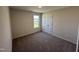 Bedroom with carpet flooring, a window providing natural light, and a closet for storage at 18 W Emily Gardens Dr, Selma, NC 27576