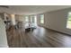 Open-concept living room with hardwood flooring, recessed lighting, and natural light at 18 W Emily Gardens Dr, Selma, NC 27576