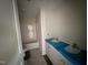 Bright bathroom featuring a double sink vanity with white cabinets and a tub-shower combo at 18 W Emily Gardens Dr, Selma, NC 27577