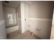 A bathroom's rough plumbing is installed next to a bathtub and shower combo at 18 W Emily Gardens Dr, Selma, NC 27577