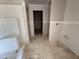A bathroom under construction with gray walls, white trim, a shower stall and fixtures for a sink at 18 W Emily Gardens Dr, Selma, NC 27577