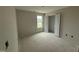 Empty bedroom with a closet and a window at 18 W Emily Gardens Dr, Selma, NC 27577