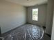 Well-lit bedroom with a window, perfect for creating a cozy and relaxing personal space at 18 W Emily Gardens Dr, Selma, NC 27577