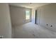 A bright bedroom with a closet, window and neutral paint, offers a comfortable space at 18 W Emily Gardens Dr, Selma, NC 27577