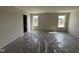 A bright bedroom featuring carpet floors, neutral walls, and two windows offering ample natural light at 18 W Emily Gardens Dr, Selma, NC 27577