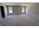 Spacious bedroom with two large windows providing ample natural light at 18 W Emily Gardens Dr, Selma, NC 27577
