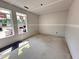 A bedroom under construction with gray walls, white trim, and two windows at 18 W Emily Gardens Dr, Selma, NC 27577