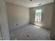 A well-lit bedroom showcases a view through the window, creating a pleasant atmosphere at 18 W Emily Gardens Dr, Selma, NC 27577