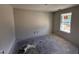 Spacious bedroom with freshly painted walls and bright natural light from a single window at 18 W Emily Gardens Dr, Selma, NC 27577