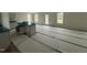 Spacious kitchen with an island, new cabinets, and lots of natural light from multiple windows at 18 W Emily Gardens Dr, Selma, NC 27577