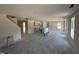 Open floor plan with kitchen featuring cabinets covered in plastic, new appliances and lots of light at 18 W Emily Gardens Dr, Selma, NC 27577