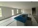 Kitchen with a large island sink and lots of natural light from multiple windows at 18 W Emily Gardens Dr, Selma, NC 27577