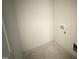 Interior view of an unfinished laundry room with new electric and water hookups at 18 W Emily Gardens Dr, Selma, NC 27577
