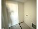 A compact laundry room with connections for a washer and dryer and featuring neutral walls at 18 W Emily Gardens Dr, Selma, NC 27577