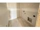 Small unfinished laundry room with washer and dryer hookups at 18 W Emily Gardens Dr, Selma, NC 27577
