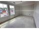 Bright, unfinished living room boasting large windows providing a sunny view at 18 W Emily Gardens Dr, Selma, NC 27577
