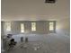 Bright living room showcasing newly painted walls, recessed lights, and a sliding glass door at 18 W Emily Gardens Dr, Selma, NC 27577
