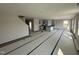 Spacious living room featuring an open layout, stairs, and a kitchen with modern finishes and abundant natural light at 18 W Emily Gardens Dr, Selma, NC 27577